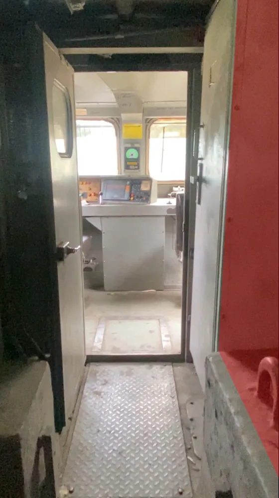 Looking through the open cabin door into the WAG-9 driving compartment, past the space beside the lavatory unit