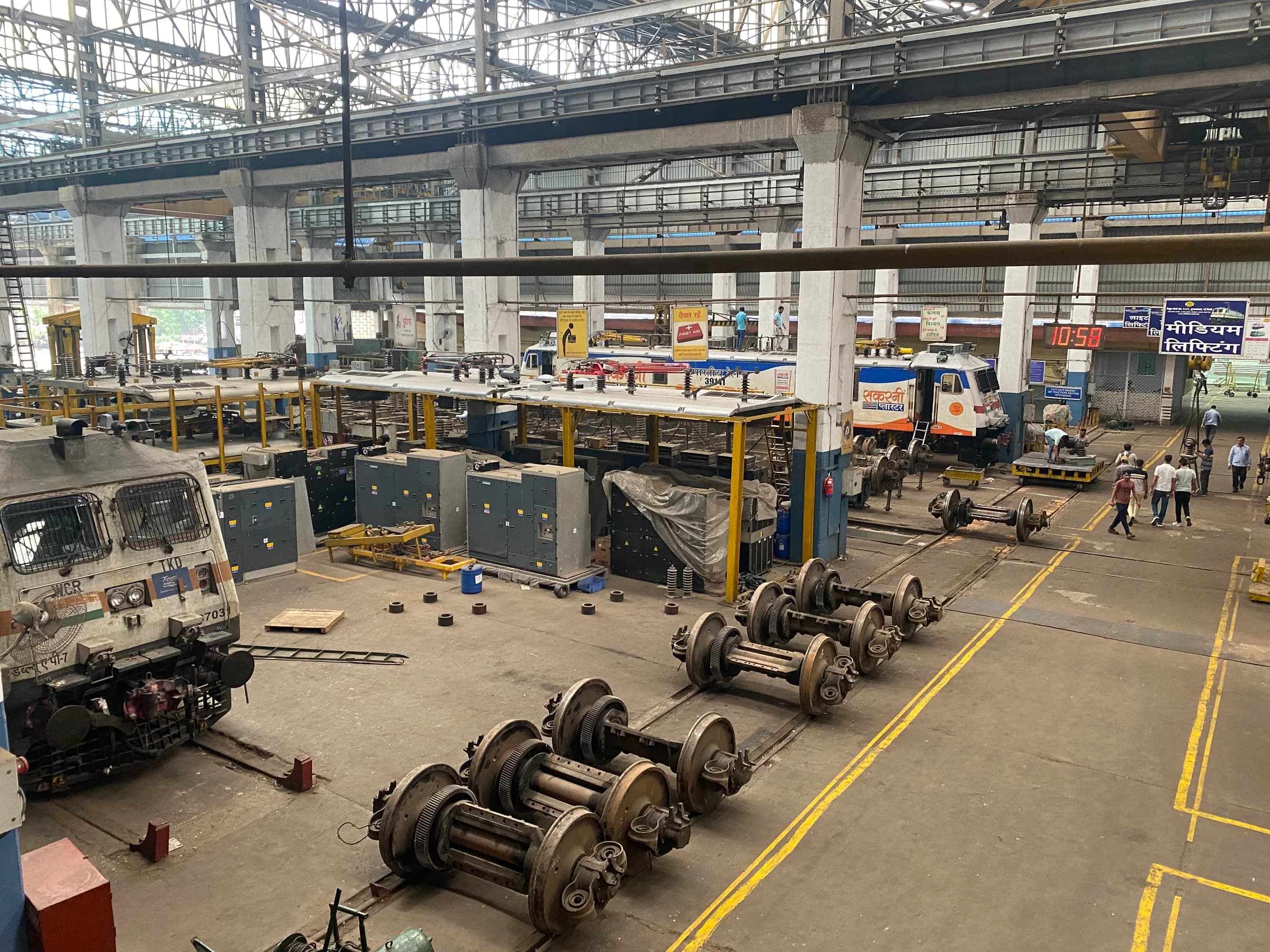 The Tughlaqabad Loco Shed floor, locomotives and wheelsets under an overhead crane